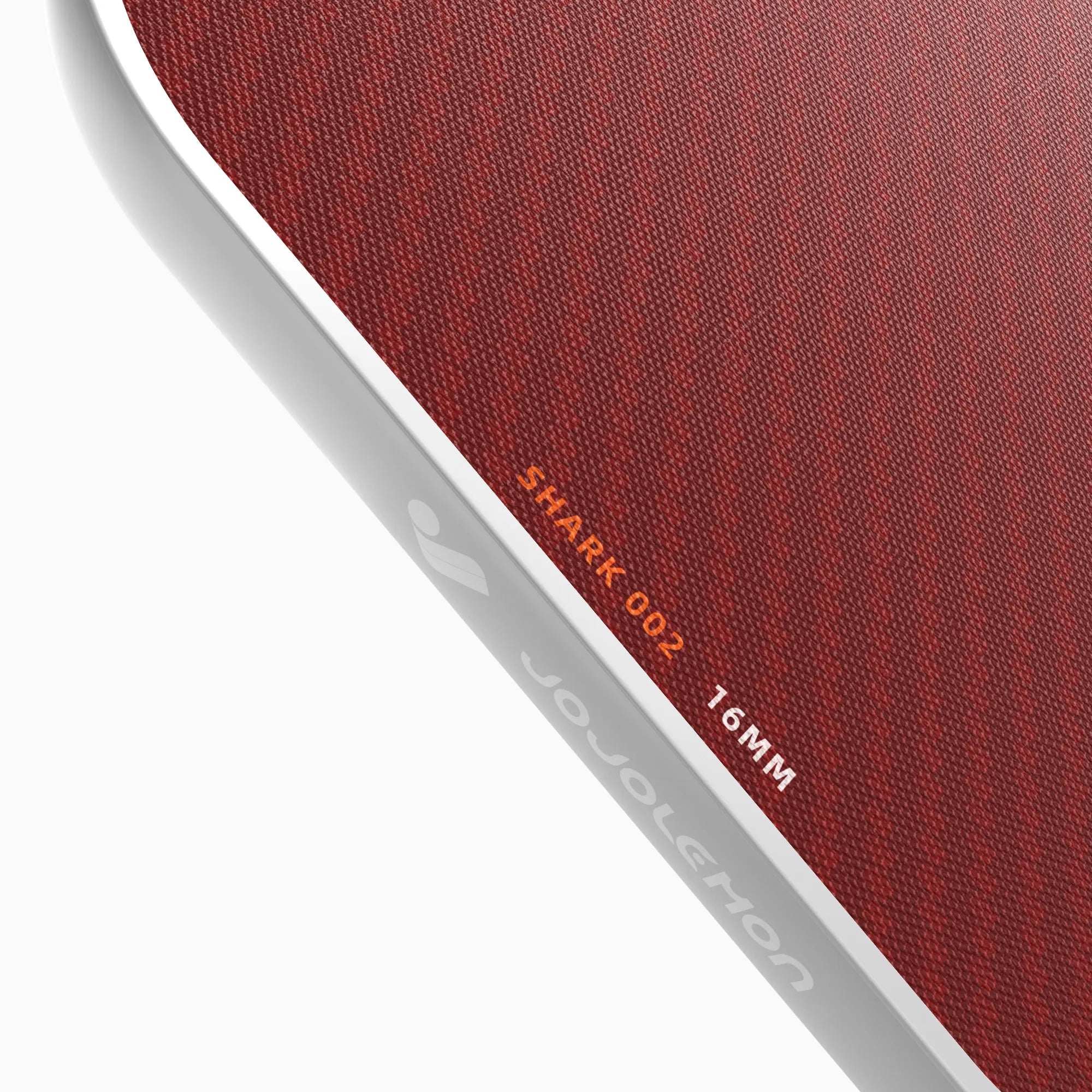 Close-up of the durable edge guard on the JOJOLEMON Shark-002 paddle, preventing damage from court strikes.