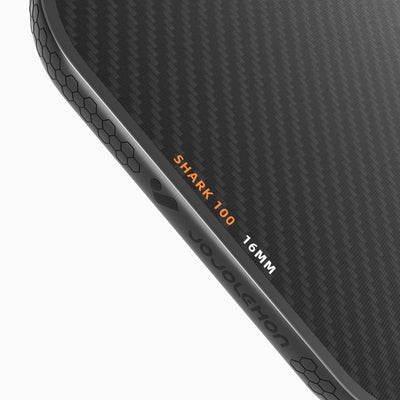 Close-up of the durable edge guard on the JOJOLEMON Shark-100 paddle, preventing damage from court strikes.